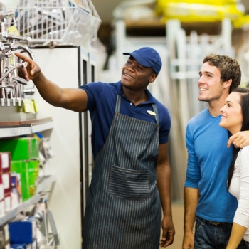 Hardware store retail worker helping customers